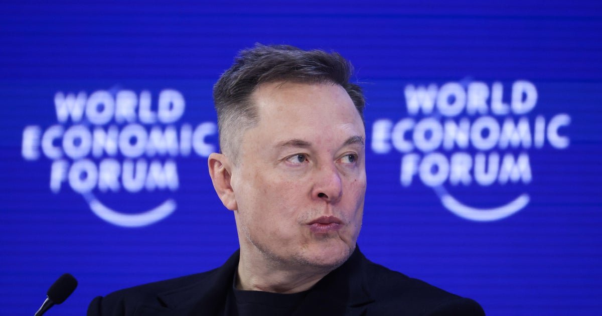 Elon Musk, a fierce Davos critic, tells World Economic Forum that robots will outnumber humans
